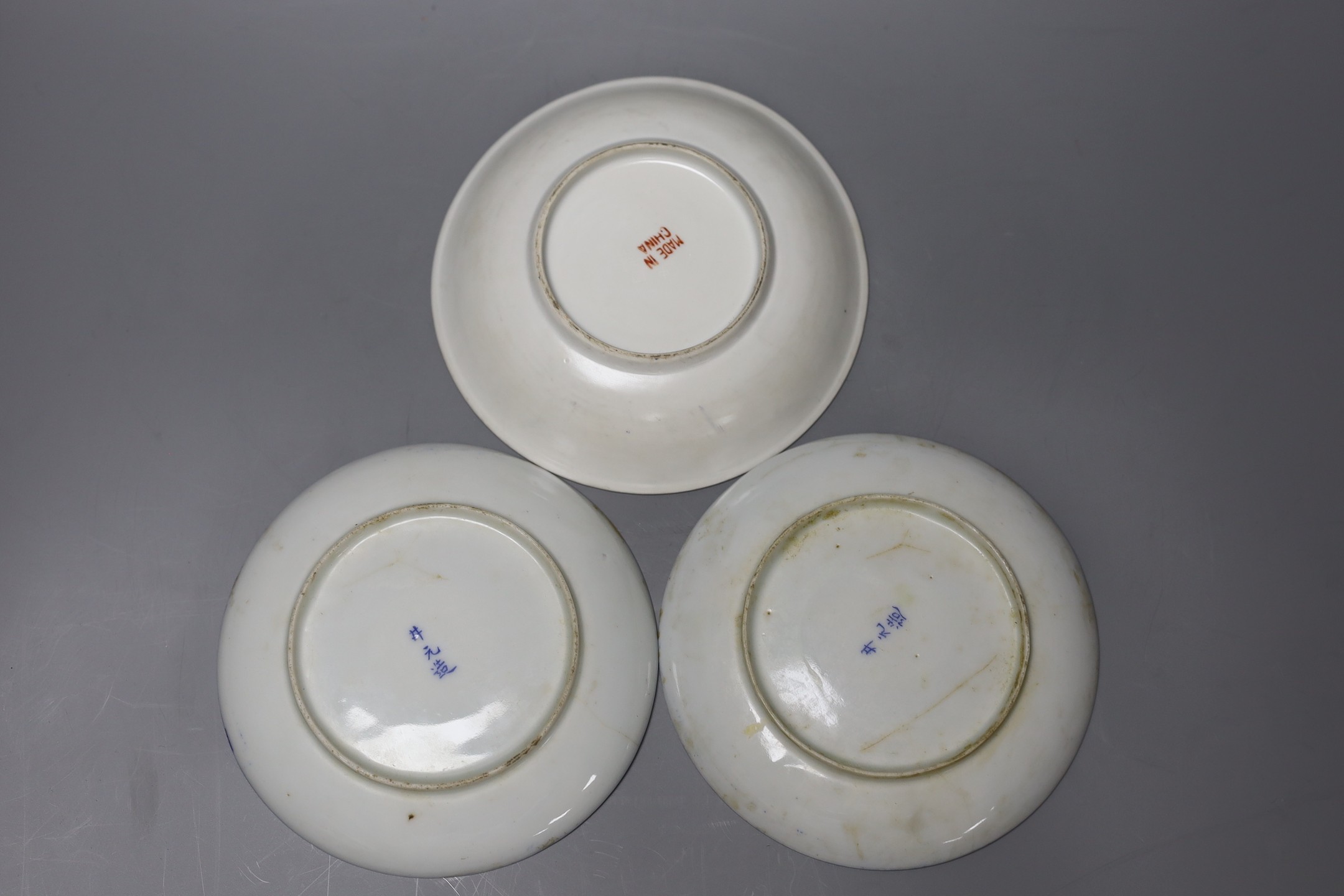 A selection of Oriental items, to include blue and white Japanese saucers, two stoneware tea bowls, a Chinese blue and white paste box and cover, and a Yixing teapot and a pair of tea bowls